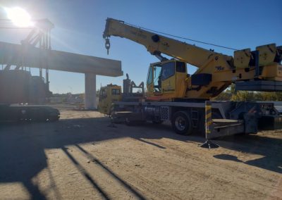 Blue's Crane Service crane getting ready to stabilize to perform a lift.