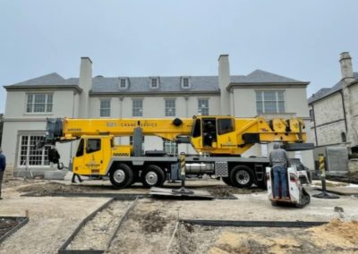 Blue's Crane Service Crane on a busy construction site.