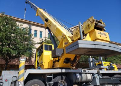 Blue's Crane Service crane with rigging on it's hook.