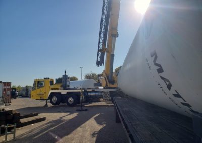 Blue's Crane Service crane behind a tank ready to do a lift.