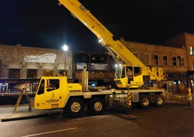 Blue's Crane Service crane at the Fort Worth Stockyards set up for a lift.