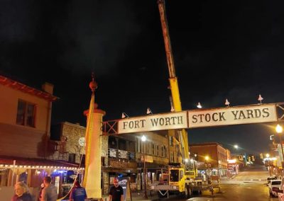 Blue's Crane Service crane performing a lift at the Fort Worth Stock Yards.