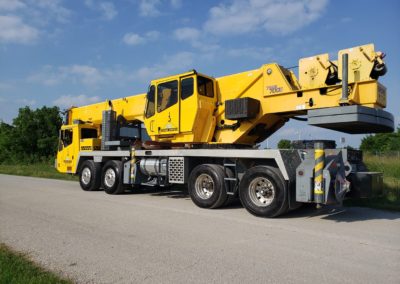 Blue's Crane Service crane on the road.