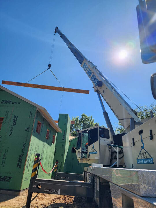 Blue's Crane Service crane making a lift for a new build.